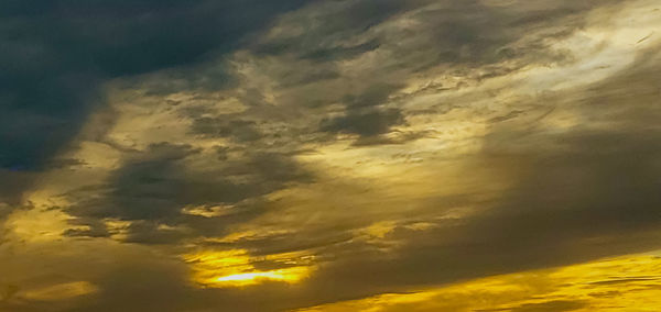 Low angle view of dramatic sky during sunset