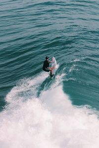 High angle view of man surfing in sea