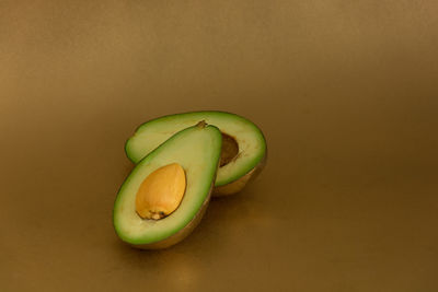 Close-up of green fruit on table