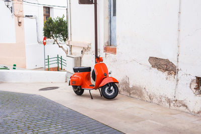 Motorcycle on street against building