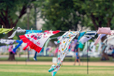 Multi colored flags hanging on field