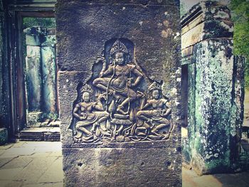 View of statue against temple building