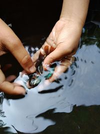 Close-up of hand holding water