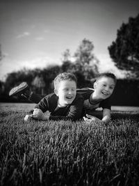 Portrait of friends and son on field