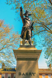 Low angle view of statue against sky