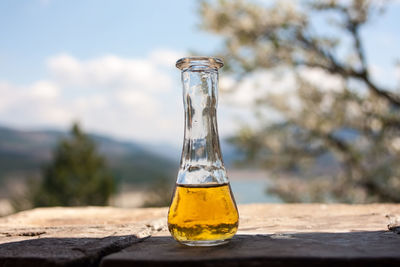 Close-up of glass bottle on table