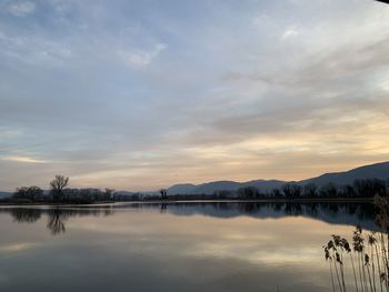 Scenic view of lake against sky during sunset