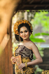 Smiling woman in costume looking away