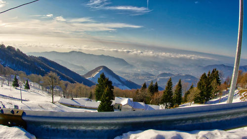 Scenic view of snowcapped mountains against sky