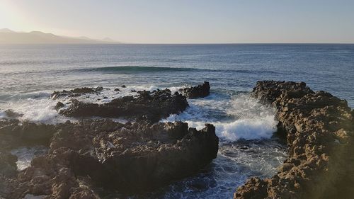 Scenic view of sea against clear sky