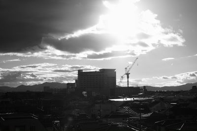 View of buildings against cloudy sky