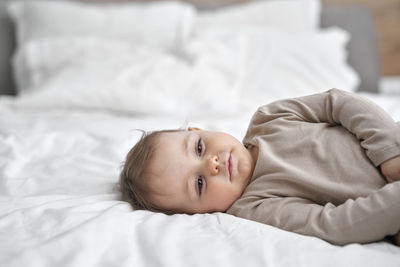 Young woman sleeping on bed at home