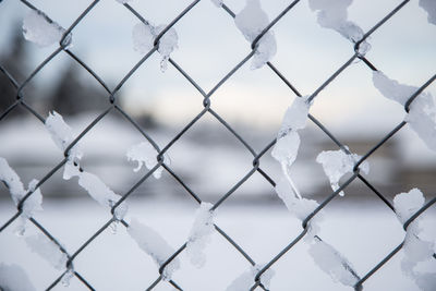 Full frame shot of chainlink fence during winter