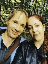 Portrait of smiling man and woman outdoors