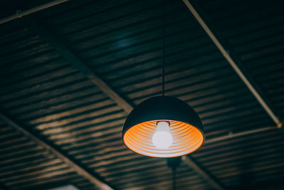 Low angle view of illuminated light bulb