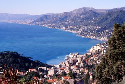 High angle view of townscape by sea