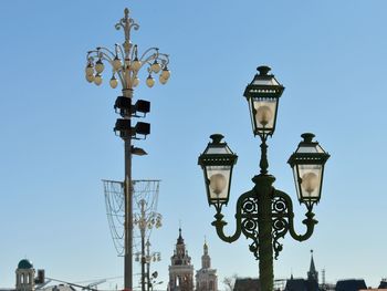 Low angle view of lamp post against sky