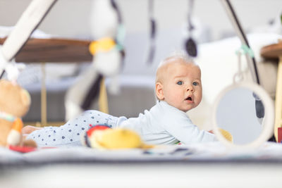 Portrait of cute baby boy sitting on boat