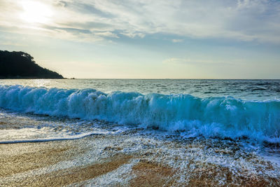 Scenic view of sea against cloudy sky