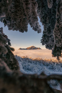 Scenic view of mountain against sky during winter