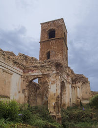 Low angle view of old building against sky