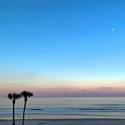 Scenic view of sea against sky at sunset