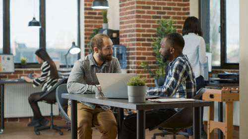 Businessman conducting interview at desk in office