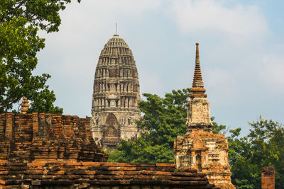 Low angle view of old temple building against sky