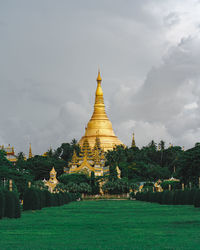 Panoramic view of temple against buildings