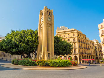 Low angle view of building against blue sky