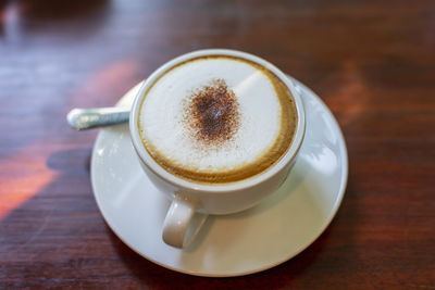 High angle view of coffee cup on table