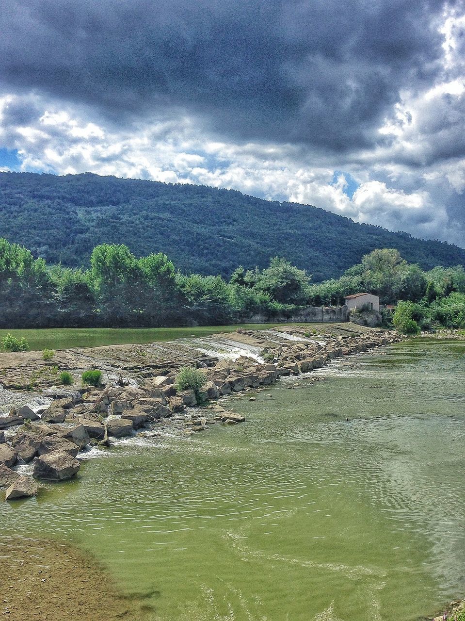 water, sky, tranquil scene, scenics, cloud - sky, tranquility, beauty in nature, nature, cloudy, mountain, cloud, landscape, rock - object, river, non-urban scene, idyllic, day, beach, remote, outdoors