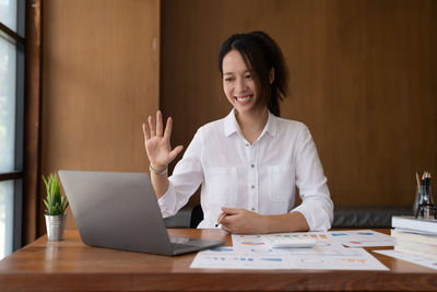 Businesswoman working at desk in office