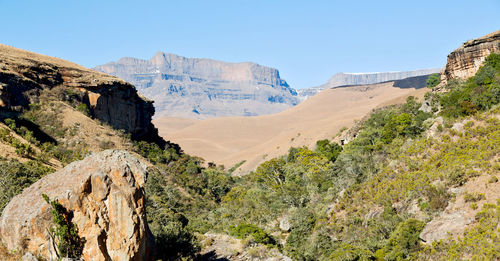 Panoramic view of landscape and mountains against clear sky