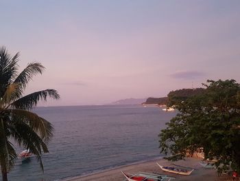 Scenic view of sea against sky at sunset