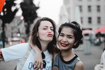 Portrait of a smiling young woman in city