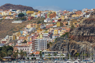 High angle view of townscape by sea