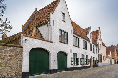 Street with historical houses in bruges historic center, belgium