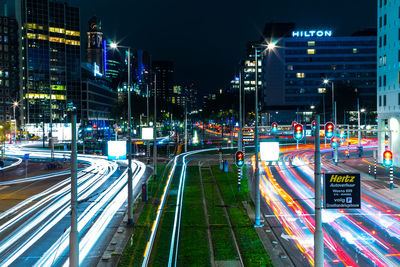 High angle view of light trails on city street at night