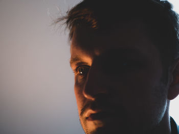 Close-up of young man against wall