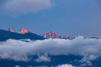 Low angle view of snowcapped mountains against sky