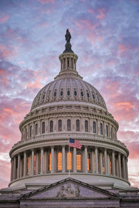 Low angle view of building against sky during sunset