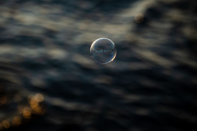 Close-up of bubbles against sky