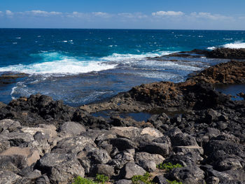 Scenic view of sea against blue sky