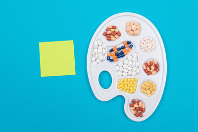 Directly above shot of food on table against blue background