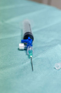 Close-up of syringe on seat