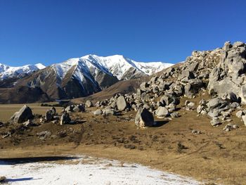 Scenic view of mountains against clear blue sky