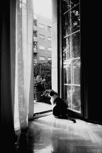 Man sitting by window at home