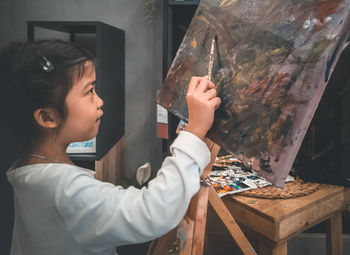 Close-up of girl painting