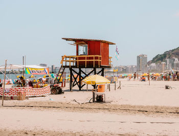 Lifeguard hut on beach against clear sky